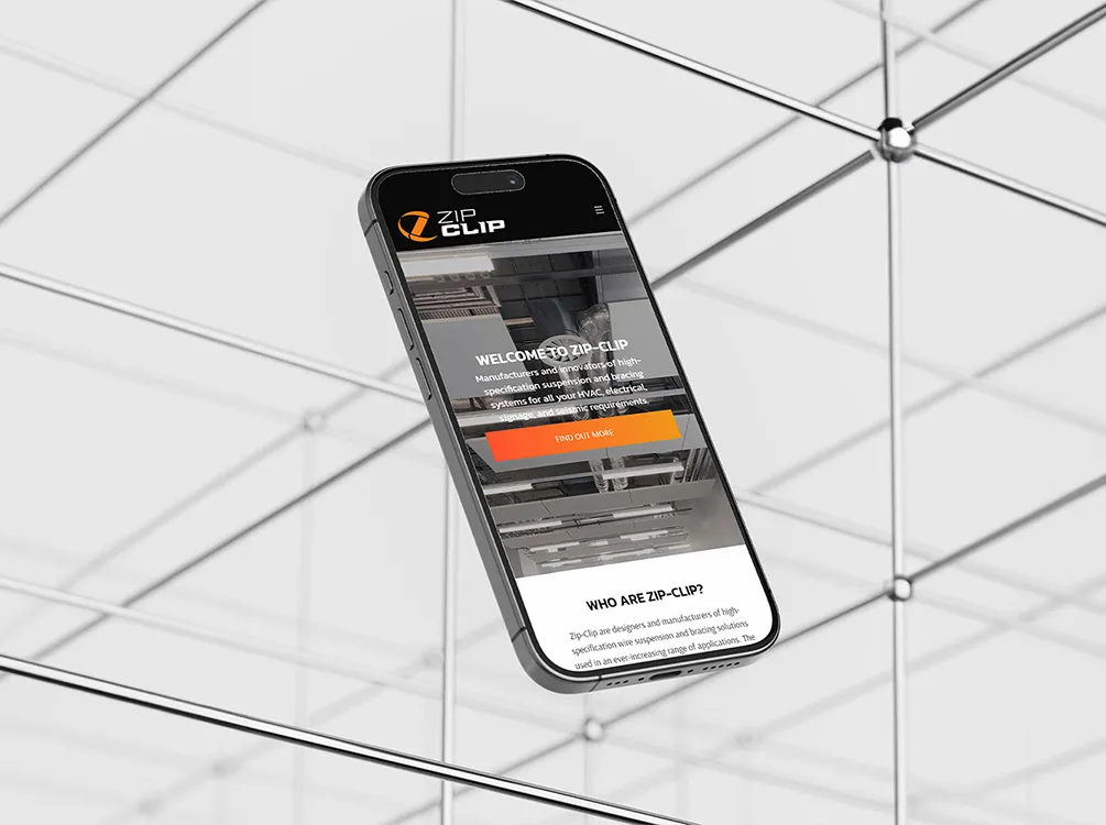 An iPhone with wire structures in the background showing the ZipClip website homepage