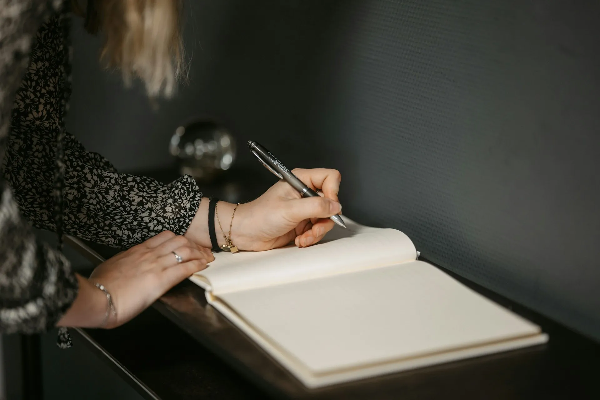 A woman writing in a notepad