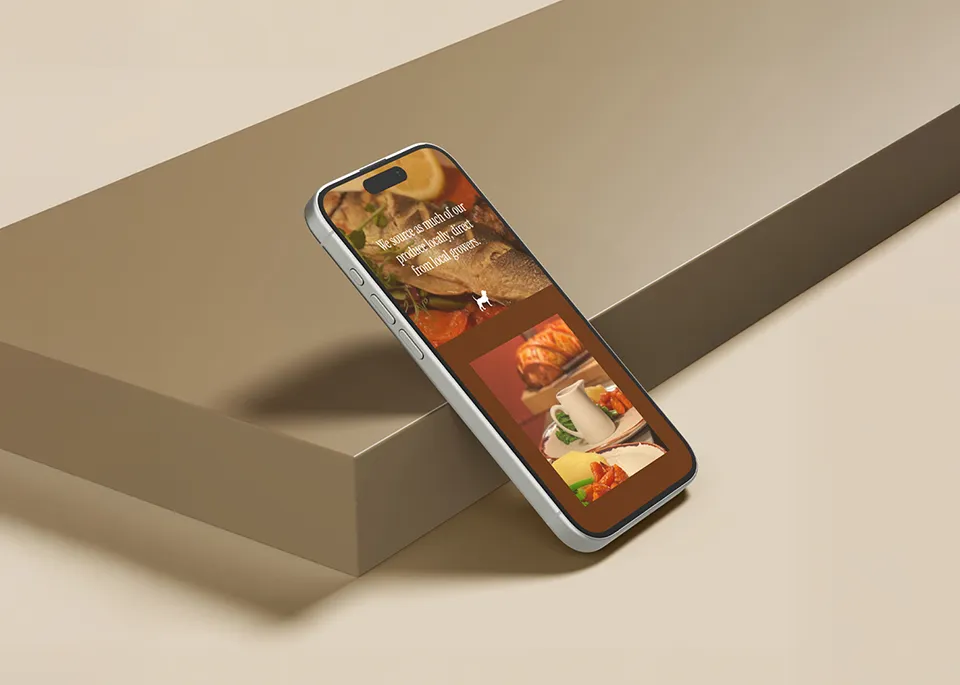 An iPhone on a beige surface displaying the Dickin Arms website menu section