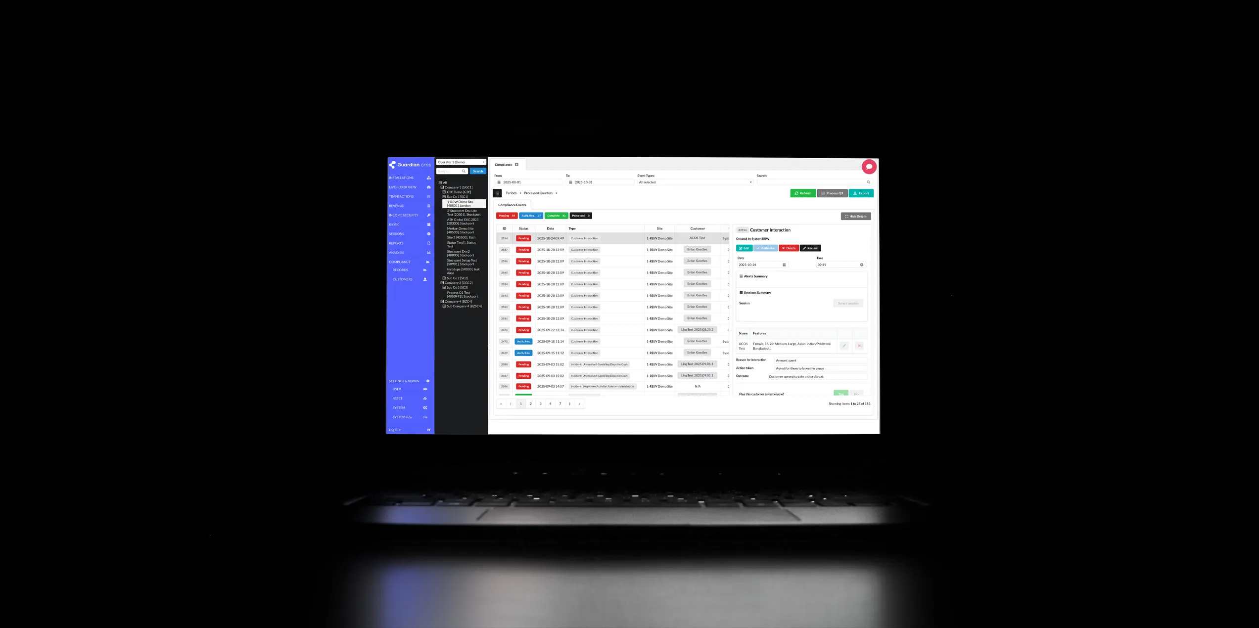 A laptop screen displaying a software dashboard with data tables and navigation menu.