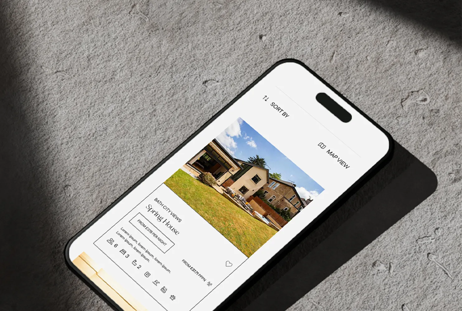 Tailored Guesty web design showing a property card on an iPhone screen